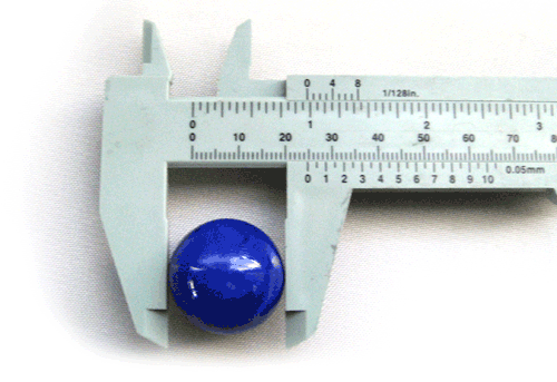 caliper tool measuring a 1 inch marble