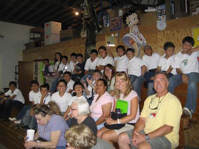 Visitors from Columbia Watch Marble Demo from Bleacher Seating