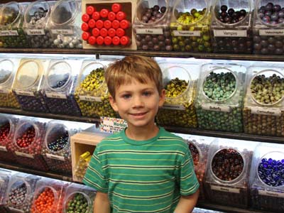 young visitor in front of marble wall